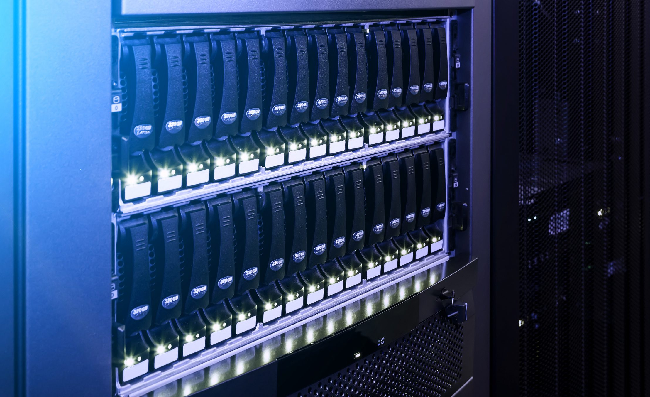 Server rack with illuminated blue lighting.