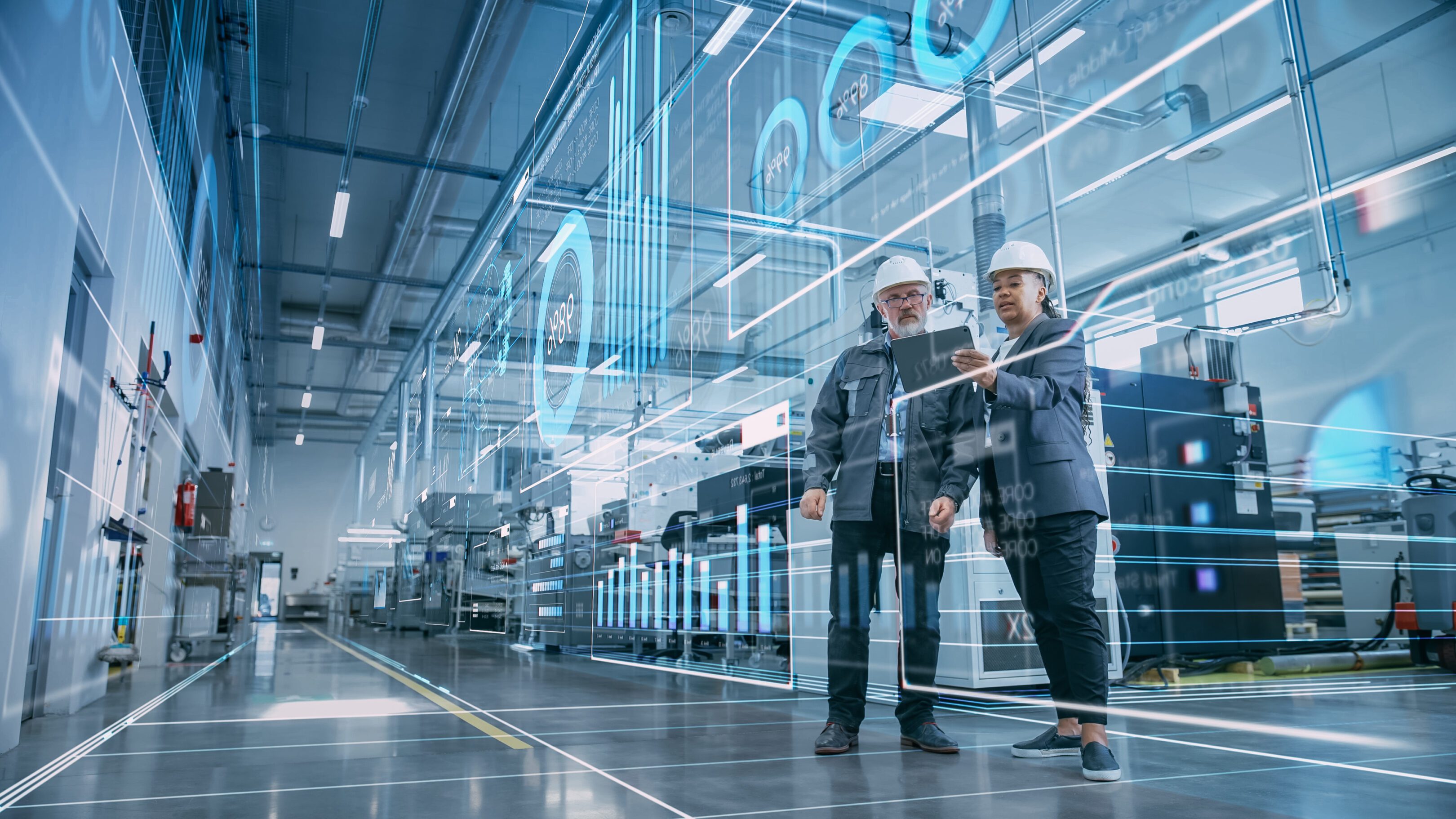 Engineers analyzing data in futuristic factory.