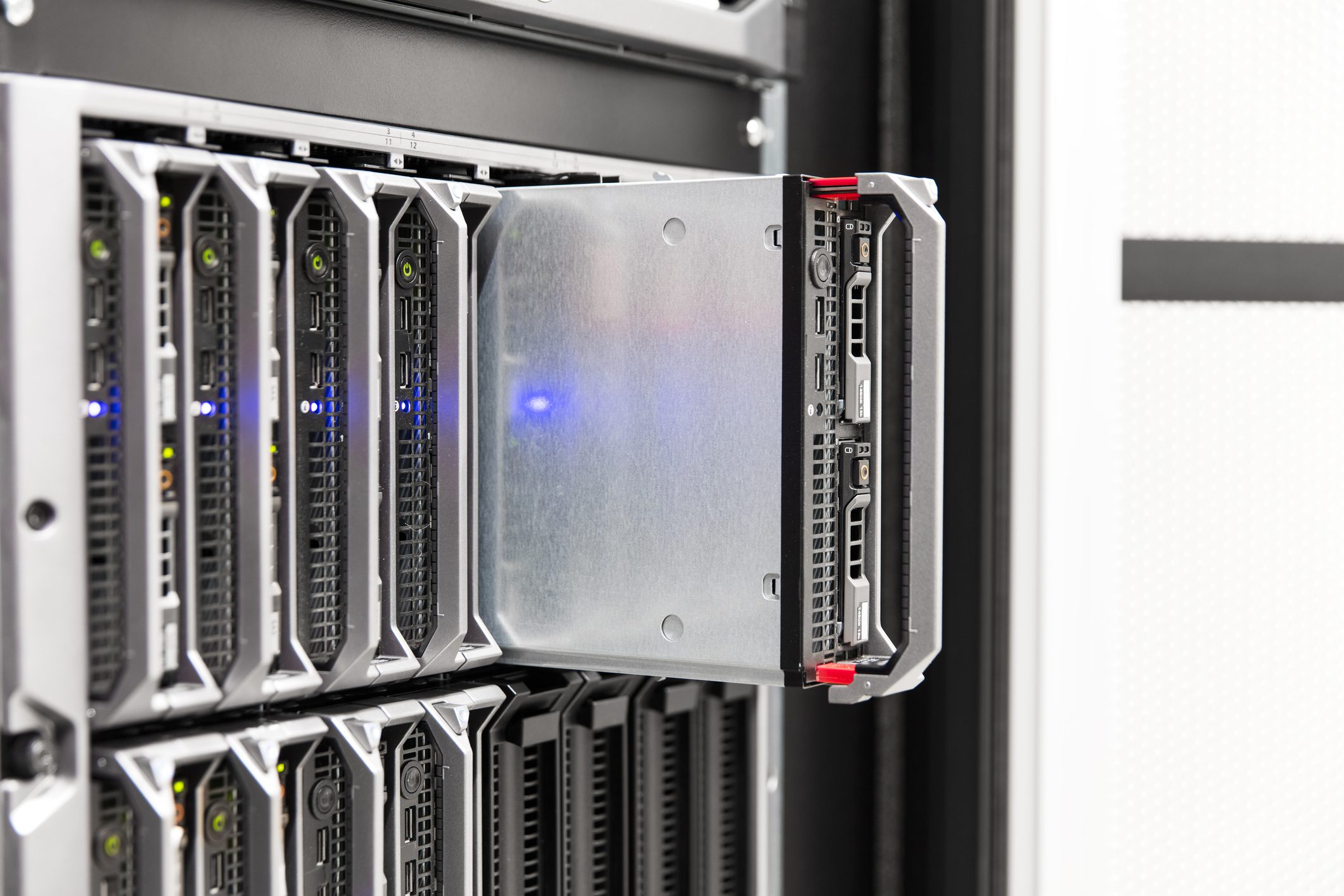 Server rack with partially removed blade.